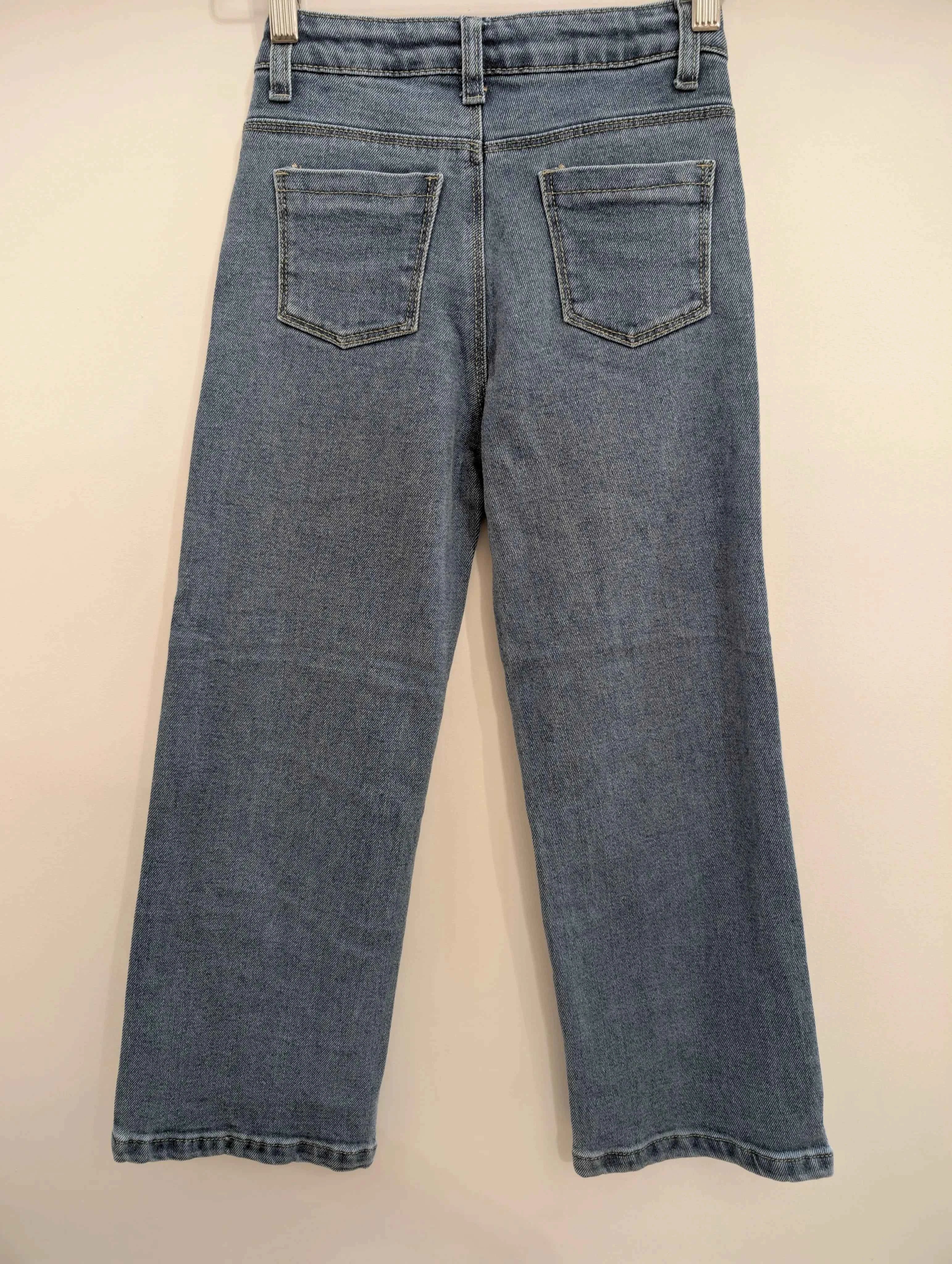 Jean large fermeture asymétrique